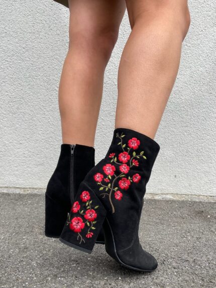 black boot heels with pink and green floral embroidery